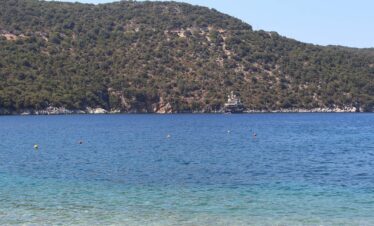 Adventurers discovering natural wonders and caves in Greece.