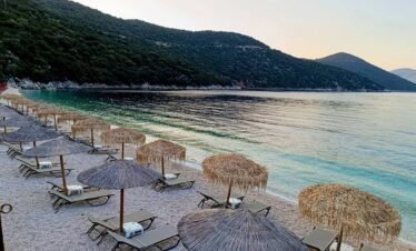 Adventurers discovering natural wonders and caves in Greece.
