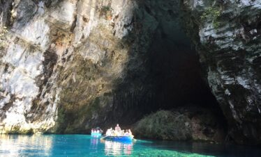 Adventurers discovering natural wonders and caves in Greece.
