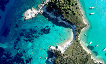 Adventurers discovering natural wonders and caves in Greece.