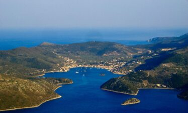 Adventurers discovering natural wonders and caves in Greece.