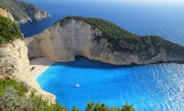 Adventurers discovering natural wonders and caves in Greece.