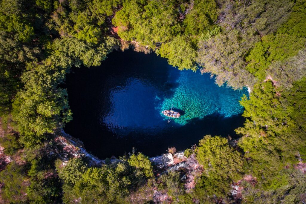 Adventurers discovering natural wonders and caves in Greece.