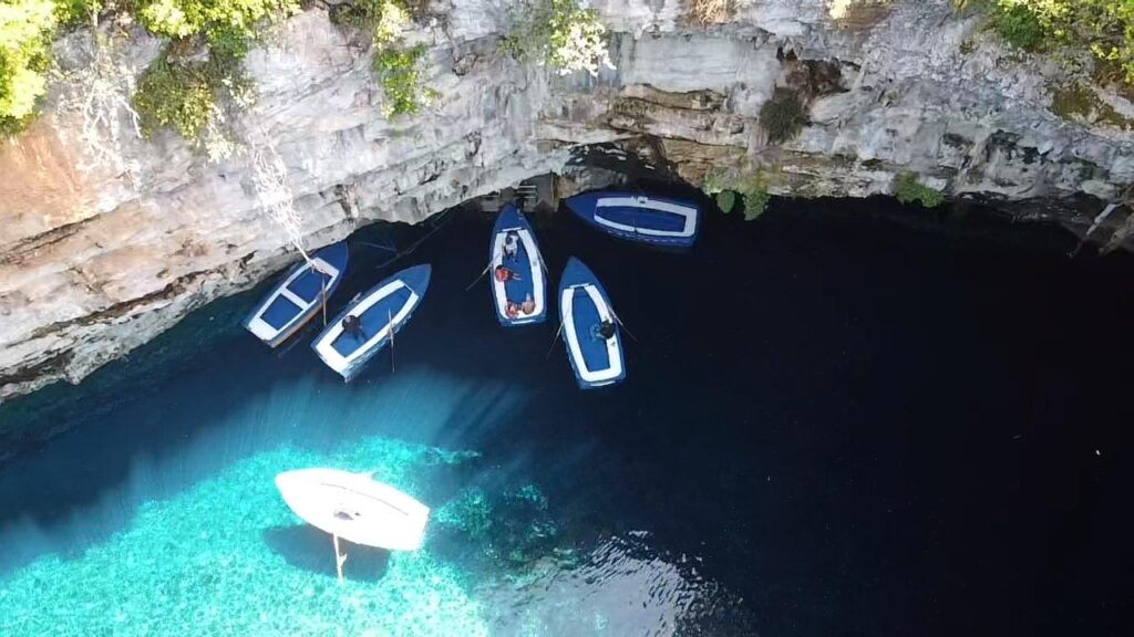 Adventurers discovering natural wonders and caves in Greece.