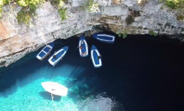 Adventurers discovering natural wonders and caves in Greece.