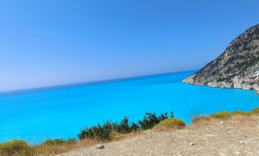 Adventurers discovering natural wonders and caves in Greece.